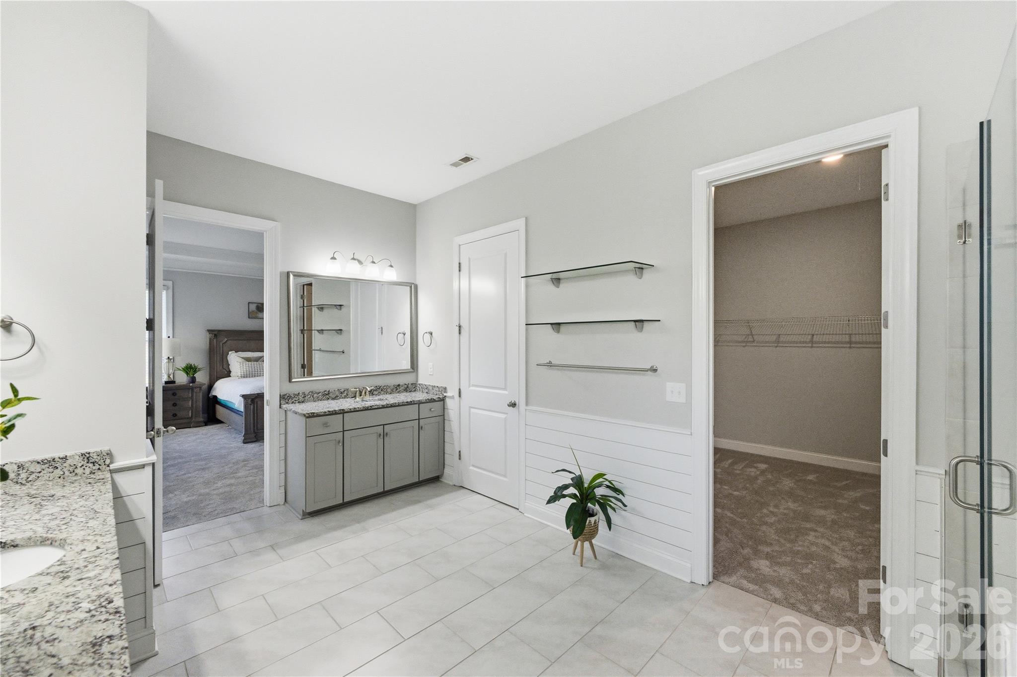 194 Forsythia Lane Tega Cay, SC 29708 - Photo 25 of 36 a large white kitchen with cabinets and stainless steel appliances