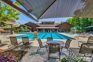 194 Forsythia Lane Tega Cay, SC 29708 - Photo 34 of 36 a view of an chairs and table in patio