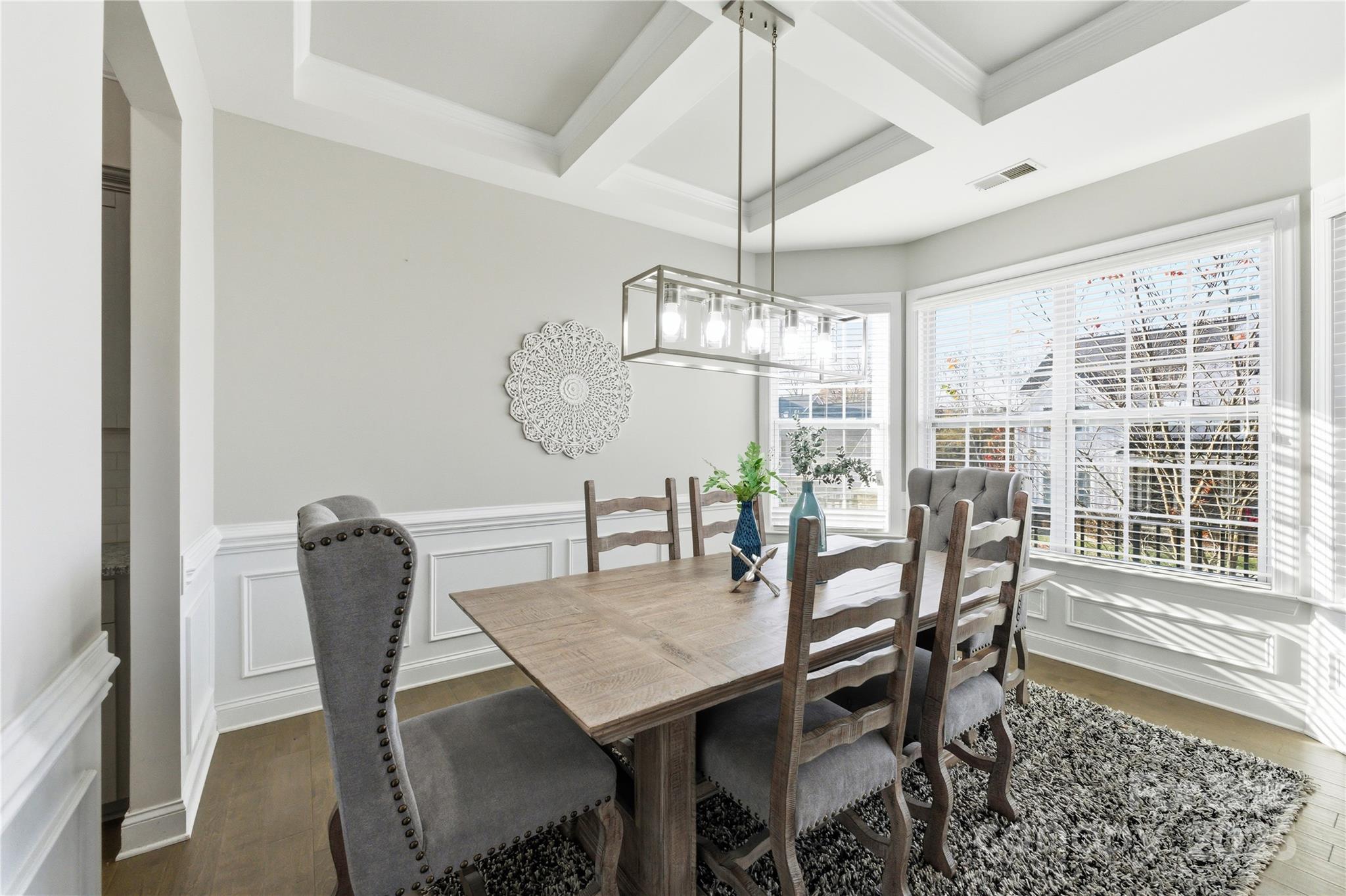194 Forsythia Lane Tega Cay, SC 29708 - Photo 6 of 31 a view of a dining room with furniture window and wooden floor