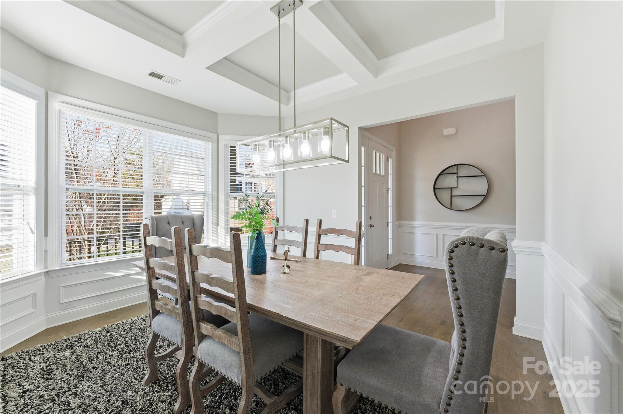 194 Forsythia Lane Tega Cay, SC 29708 - Photo 7 of 31 a dining room with furniture a chandelier and window