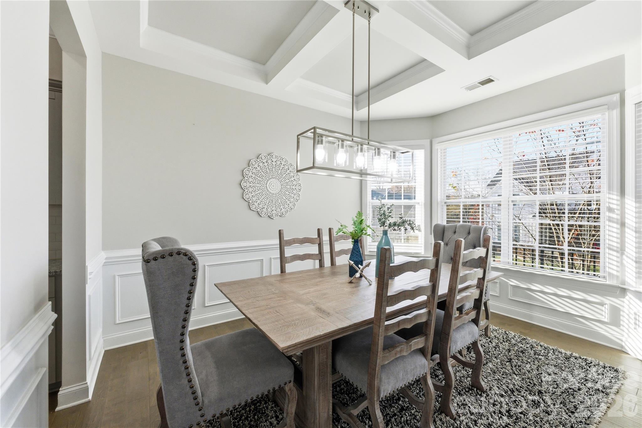 194 Forsythia Lane Tega Cay, SC 29708 - Photo 7 of 37 a view of a dining room with furniture window and wooden floor