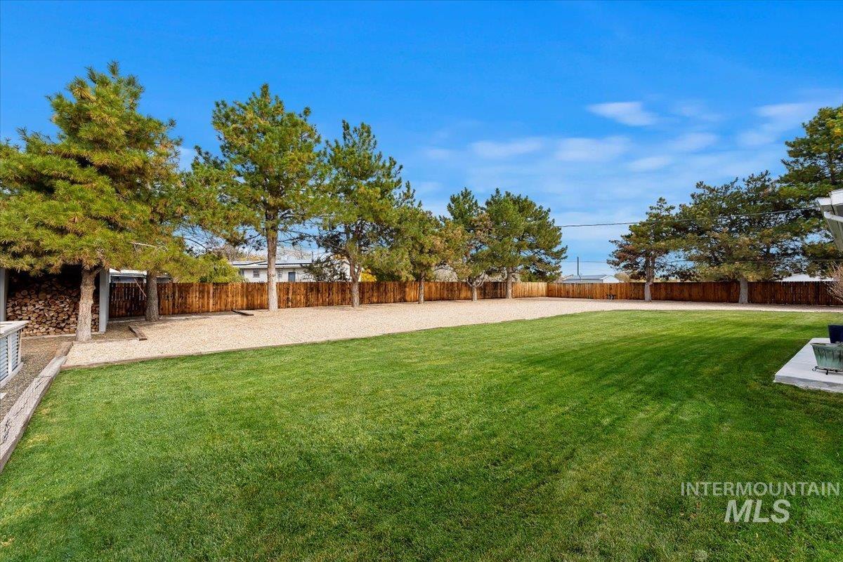 11650 Columbia Road Boise, ID 83709 - Photo 22 of 32 Fenced backyard with a patio
