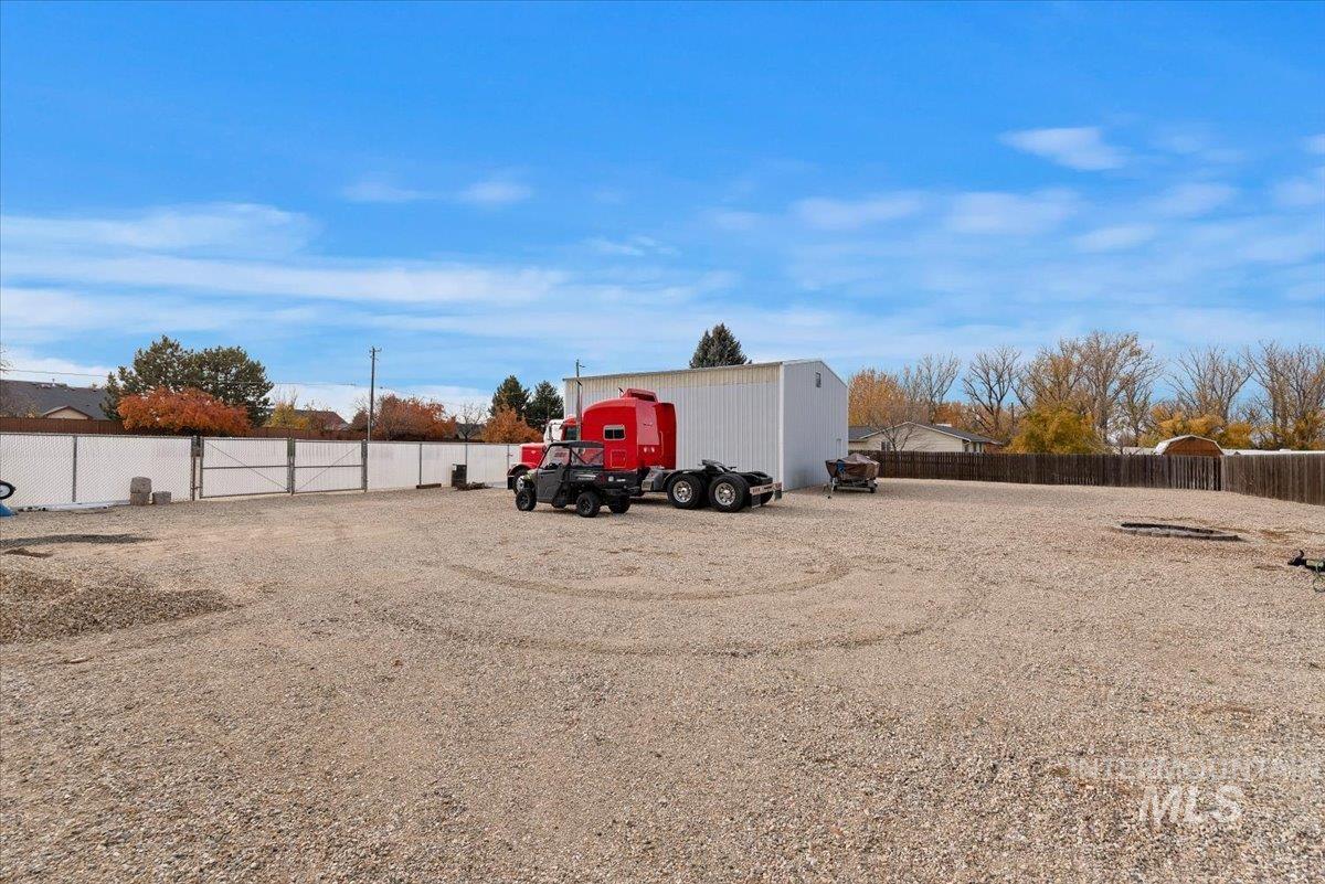 11650 Columbia Road Boise, ID 83709 - Photo 28 of 32 View of vehicle parking with a fenced backyard