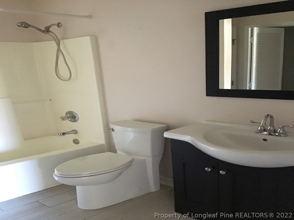 1913-4 Sardonyx Road Fayetteville, NC 28303 - Photo 12 of 12 a bathroom with a sink a toilet and shower