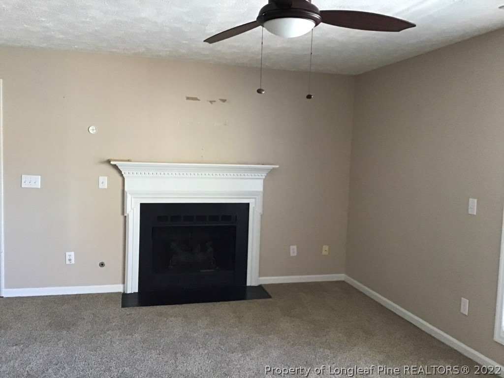 1913-4 Sardonyx Road Fayetteville, NC 28303 - Photo 2 of 12 an empty room with a fireplace