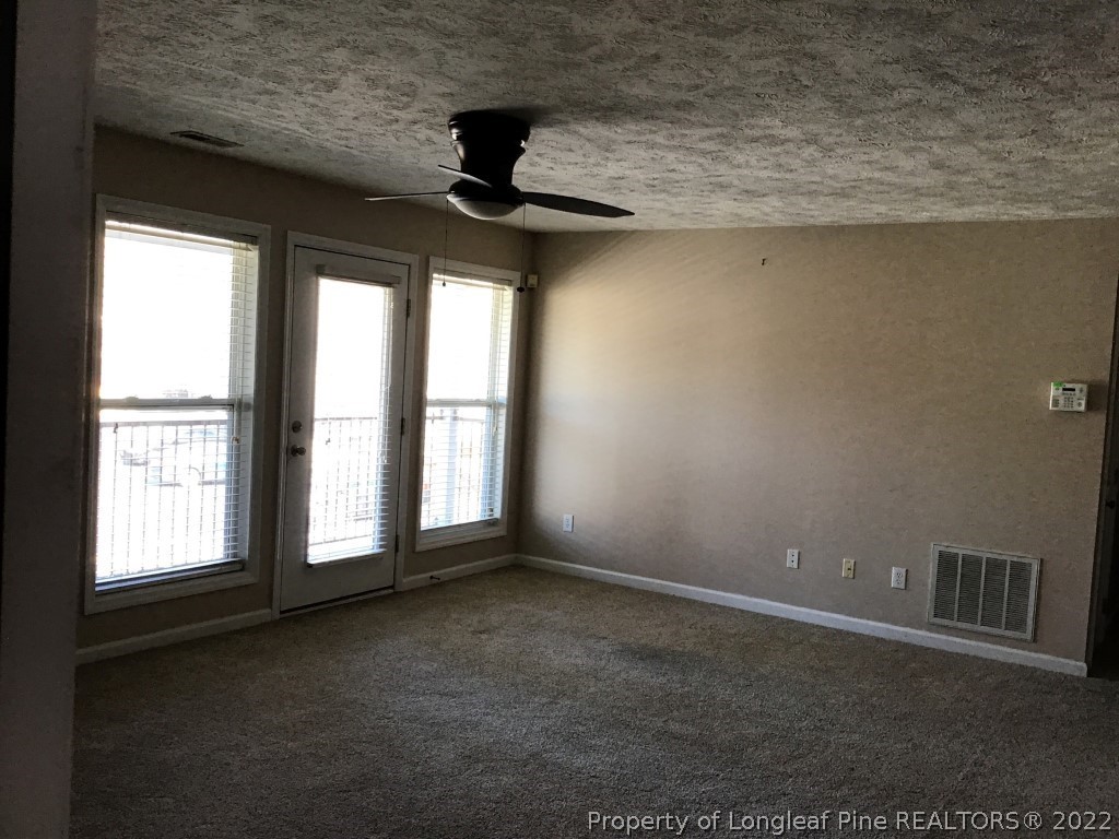 1913-4 Sardonyx Road Fayetteville, NC 28303 - Photo 3 of 12 a view of an empty room with a window
