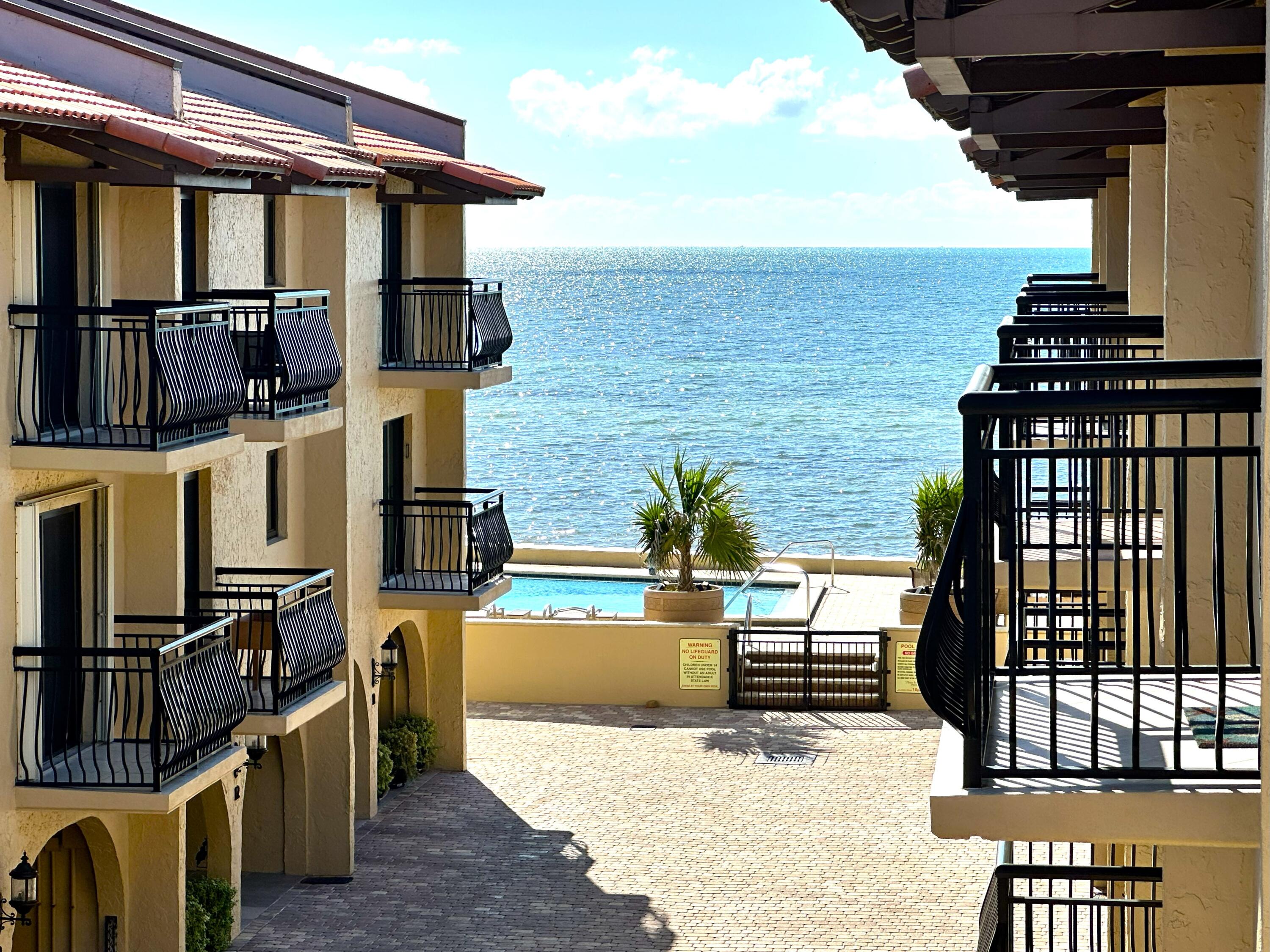 1616 Atlantic Boulevard, Unit 5 Key West, FL 33040 - Photo 3 of 3 a view of a patio with chairs and potted plants