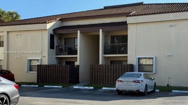 a car parked in front of a house