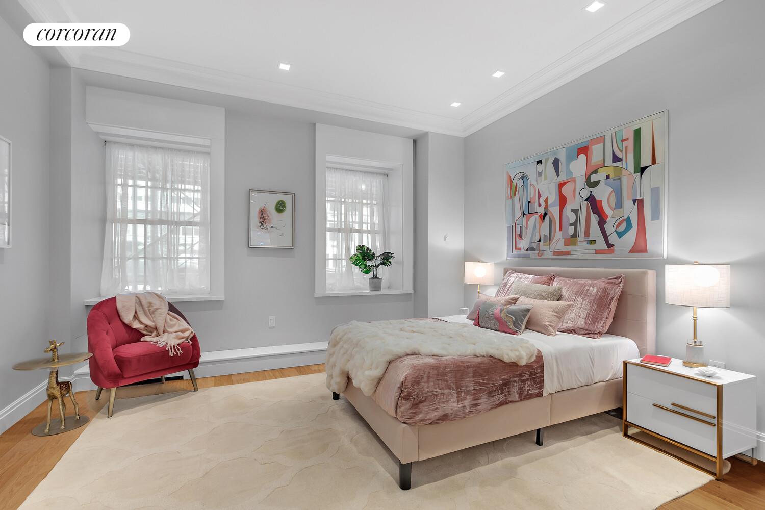 40 East 72nd Street, Unit MAIS Manhattan, NY 10021 - Photo 10 of 17 a bedroom with bed and a couch