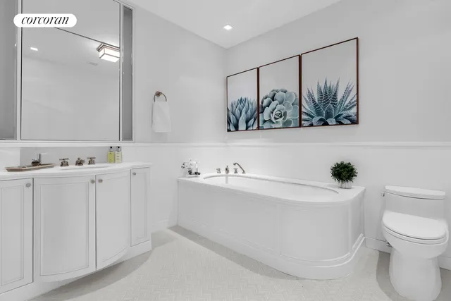 a bathroom with a bathtub and a sink