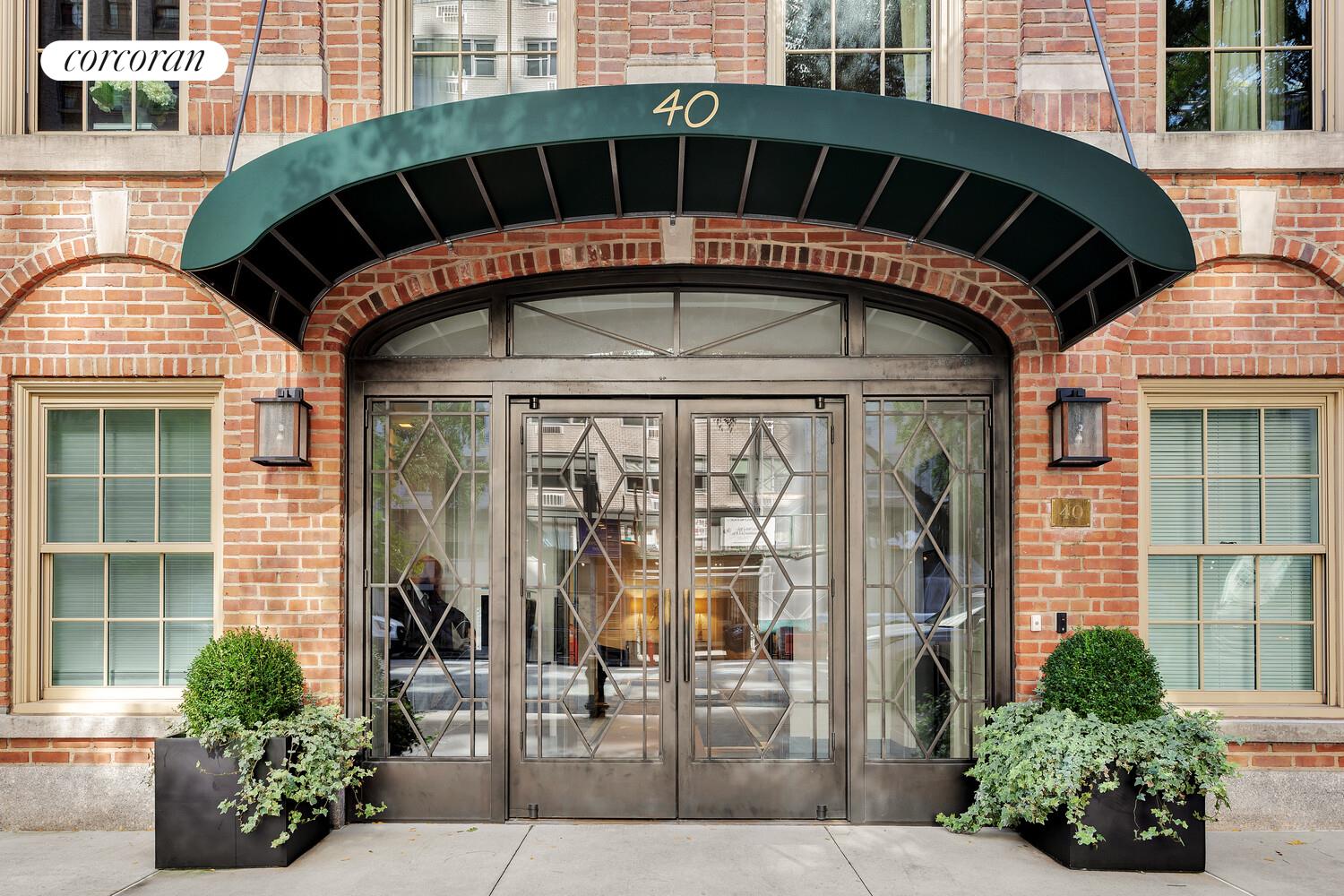 40 East 72nd Street, Unit MAIS Manhattan, NY 10021 - Photo 15 of 17 a front view of a building with glass windows and door