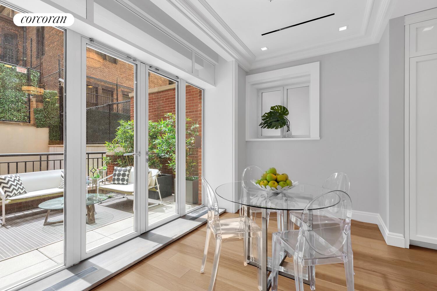 40 East 72nd Street, Unit MAIS Manhattan, NY 10021 - Photo 4 of 17 a living room with furniture and a potted plant