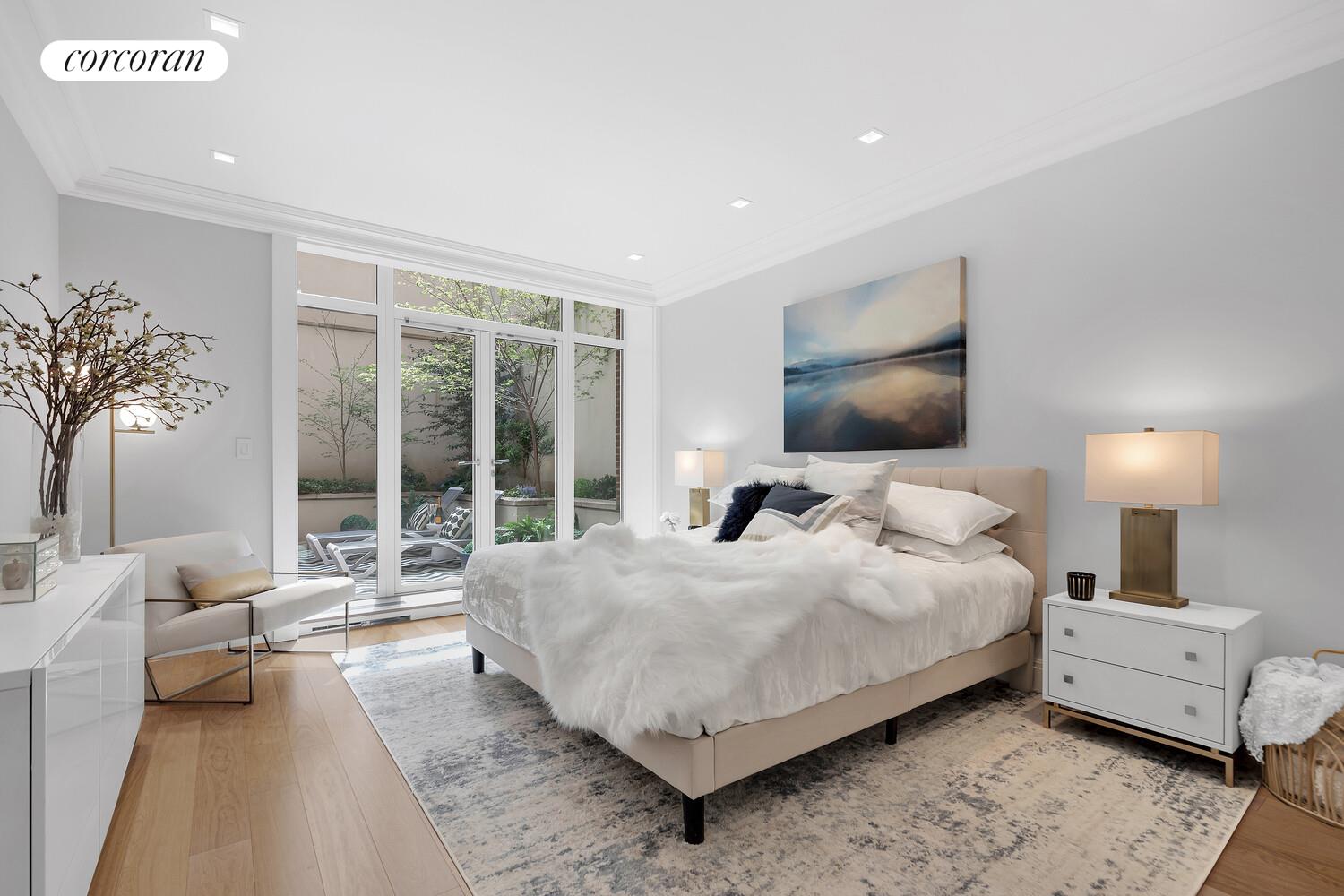 40 East 72nd Street, Unit MAIS Manhattan, NY 10021 - Photo 6 of 17 a bedroom with a large bed and a large window