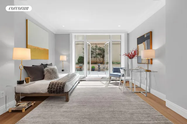 a bed room with a bed and a chair