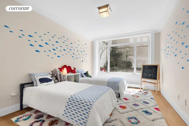 a bedroom with bed and a couch