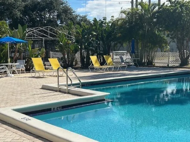a view of a swimming pool with a patio