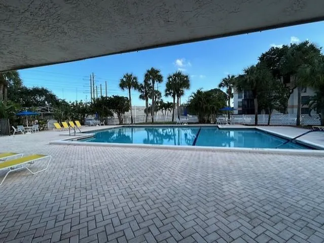 a view of swimming pool with a patio