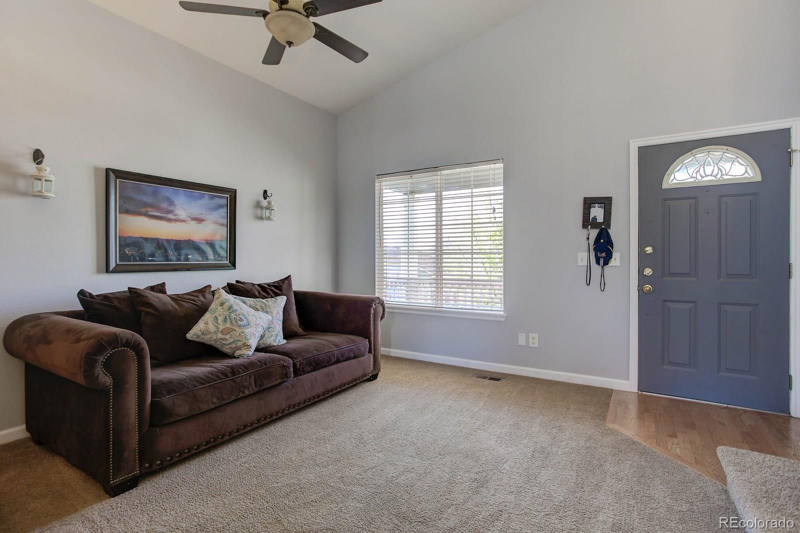9847 Sydney Lane Highlands Ranch, CO 80130 - Photo 2 of 32 a living room with furniture and window