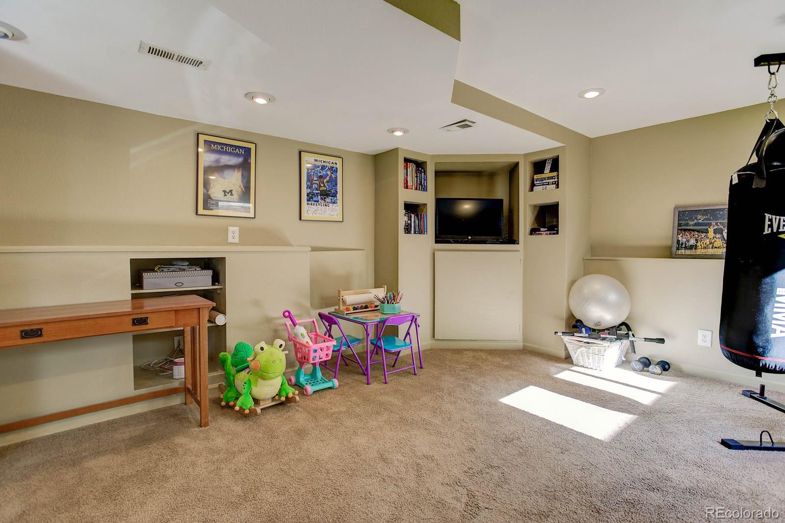 9847 Sydney Lane Highlands Ranch, CO 80130 - Photo 26 of 32 a room with furniture and toys