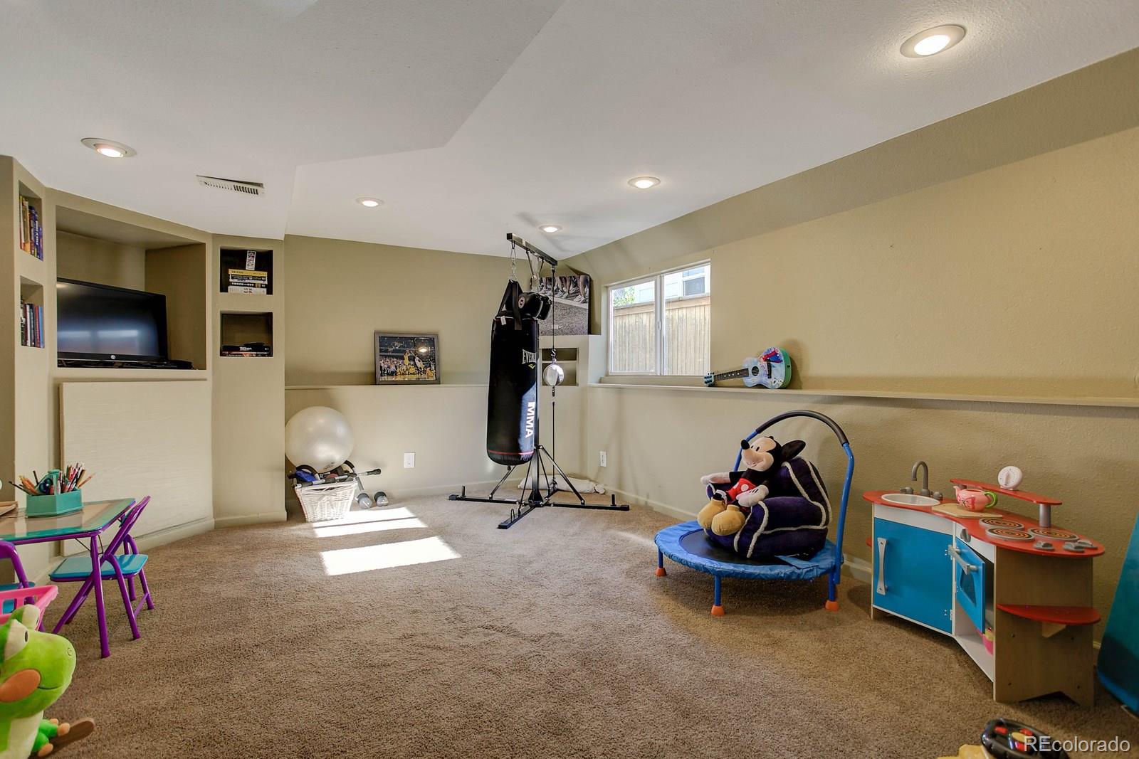 9847 Sydney Lane Highlands Ranch, CO 80130 - Photo 27 of 32 a view of a room with gym equipment