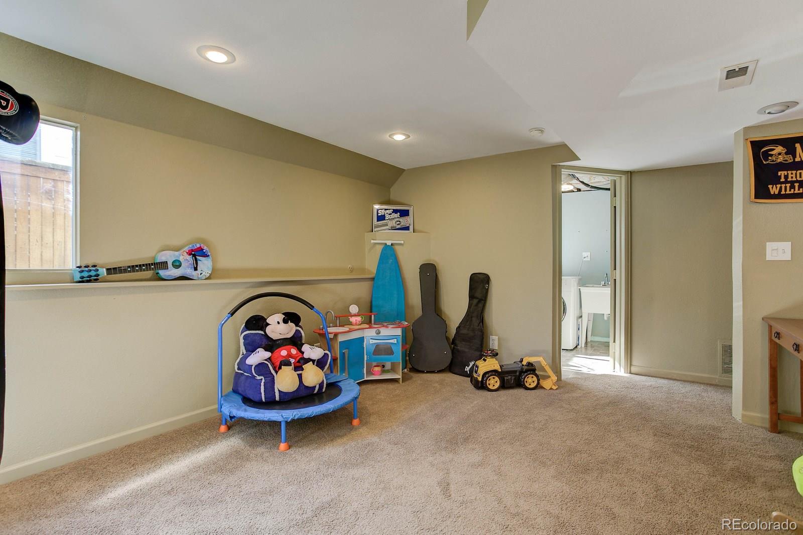 9847 Sydney Lane Highlands Ranch, CO 80130 - Photo 28 of 32 a view of a room with gym equipment