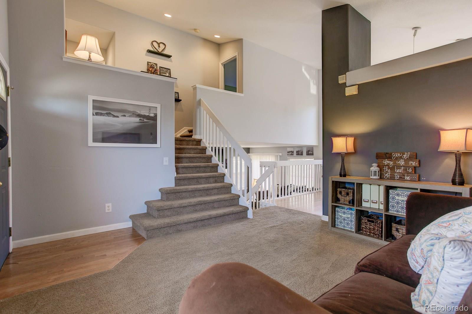 9847 Sydney Lane Highlands Ranch, CO 80130 - Photo 3 of 32 a living room with furniture and kitchen view