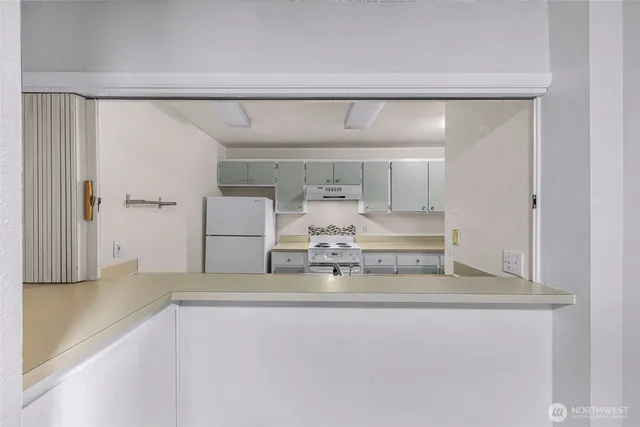 a view of kitchen with furniture and wooden floor