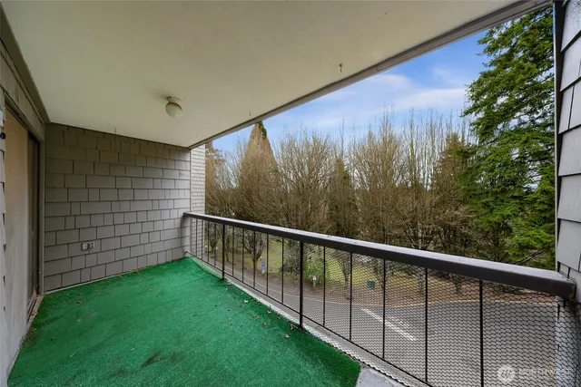 a view of swimming pool from a balcony