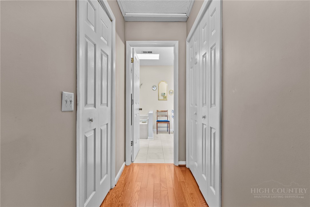 271 Quail Hollow Road Crumpler, NC 28617 - Photo 23 of 30 a view of a bedroom from a hallway