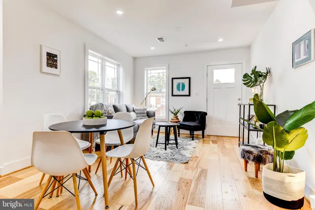 a kitchen with stainless steel appliances a refrigerator sink and microwave