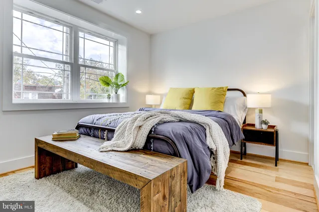 a bedroom with a bed and window