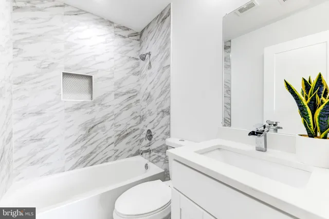 a bedroom with a bed and a table