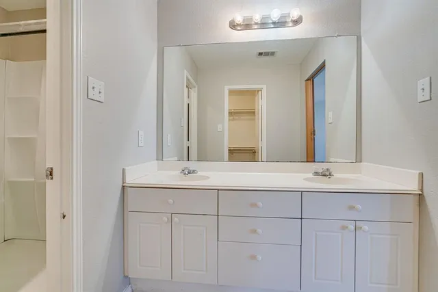 a view of an empty walk in closet