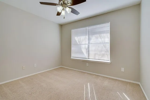 a bathroom with a sink toilet and a mirror