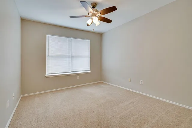 a view of a porch with a door and wooden floor