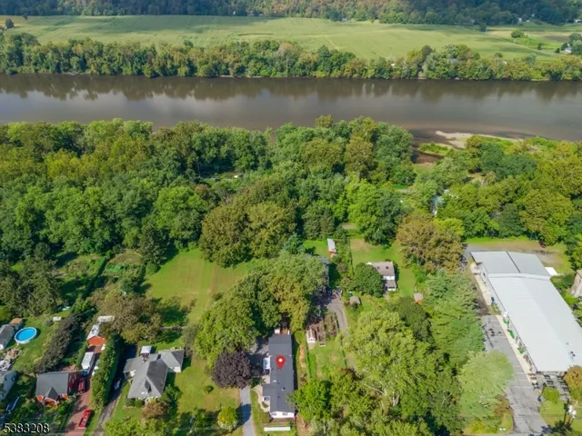 a view of a lake with a house and outdoor space