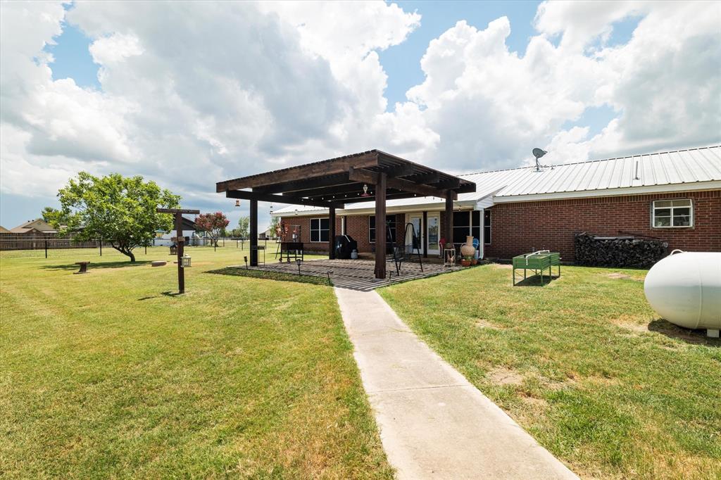 20175 Willow Glade Circle Pilot Point, TX 76258 - Photo 26 of 32 View of yard with a pergola and a patio area