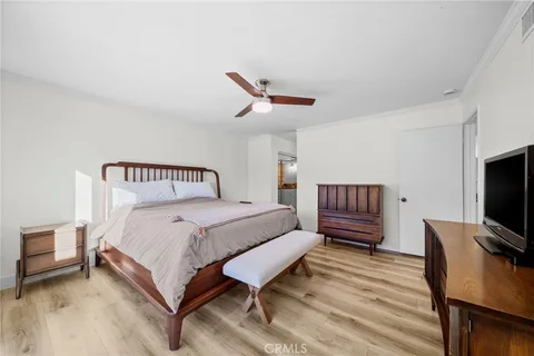 a spacious bathroom with a granite countertop sink and a shower
