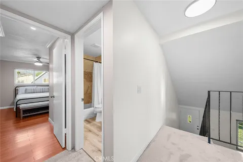 a bathroom with a sink a toilet and a view of bathroom