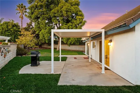 a front view of a house with a yard and porch