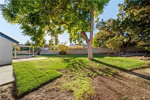 an aerial view of residential houses with city view