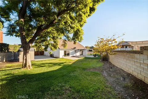 an aerial view of residential houses with city view