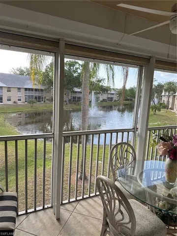 a view of a garden with lawn chairs