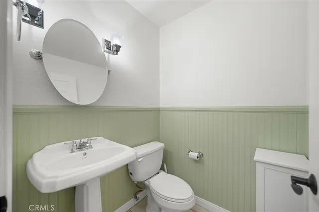 a view of washer and dryer with kitchen in the background