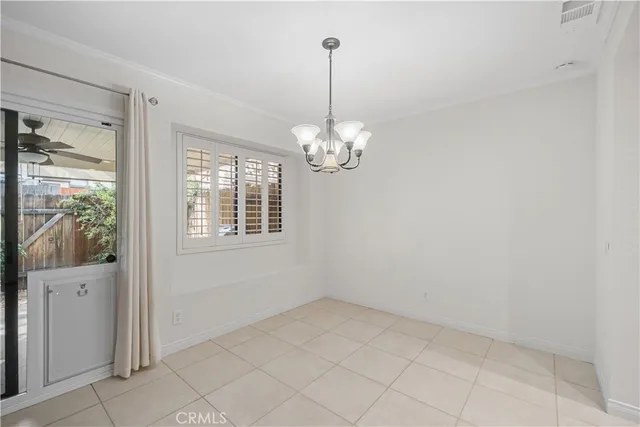 a view of a kitchen with a sink and stainless steel appliances