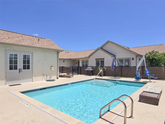a front view of house with yard and outdoor seating