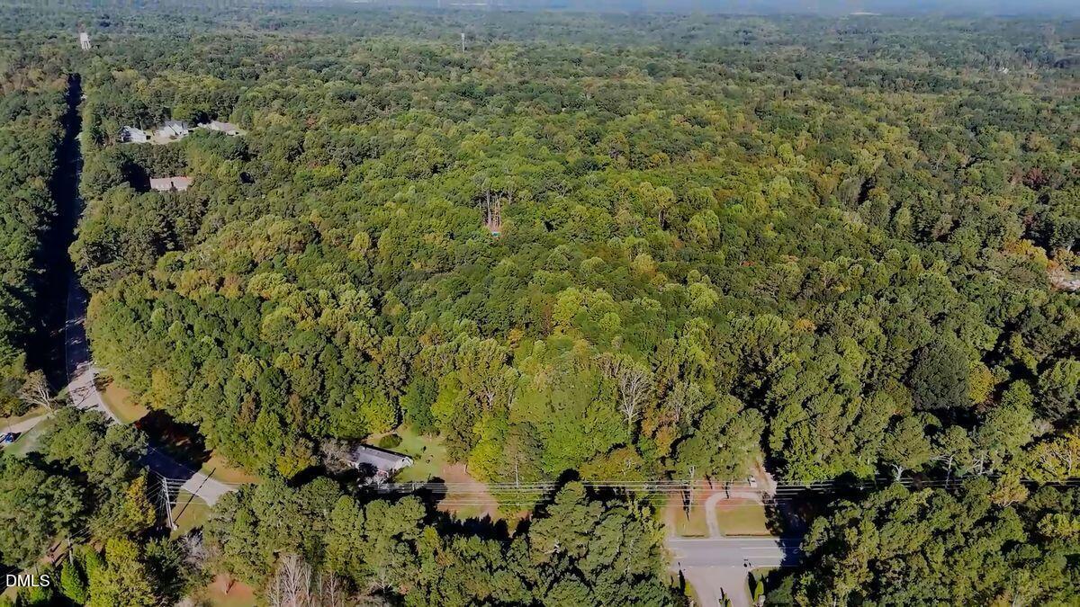 5632 Blackhawk Road Raleigh, NC 27613 - Photo 3 of 4 an aerial view of a house with a yard