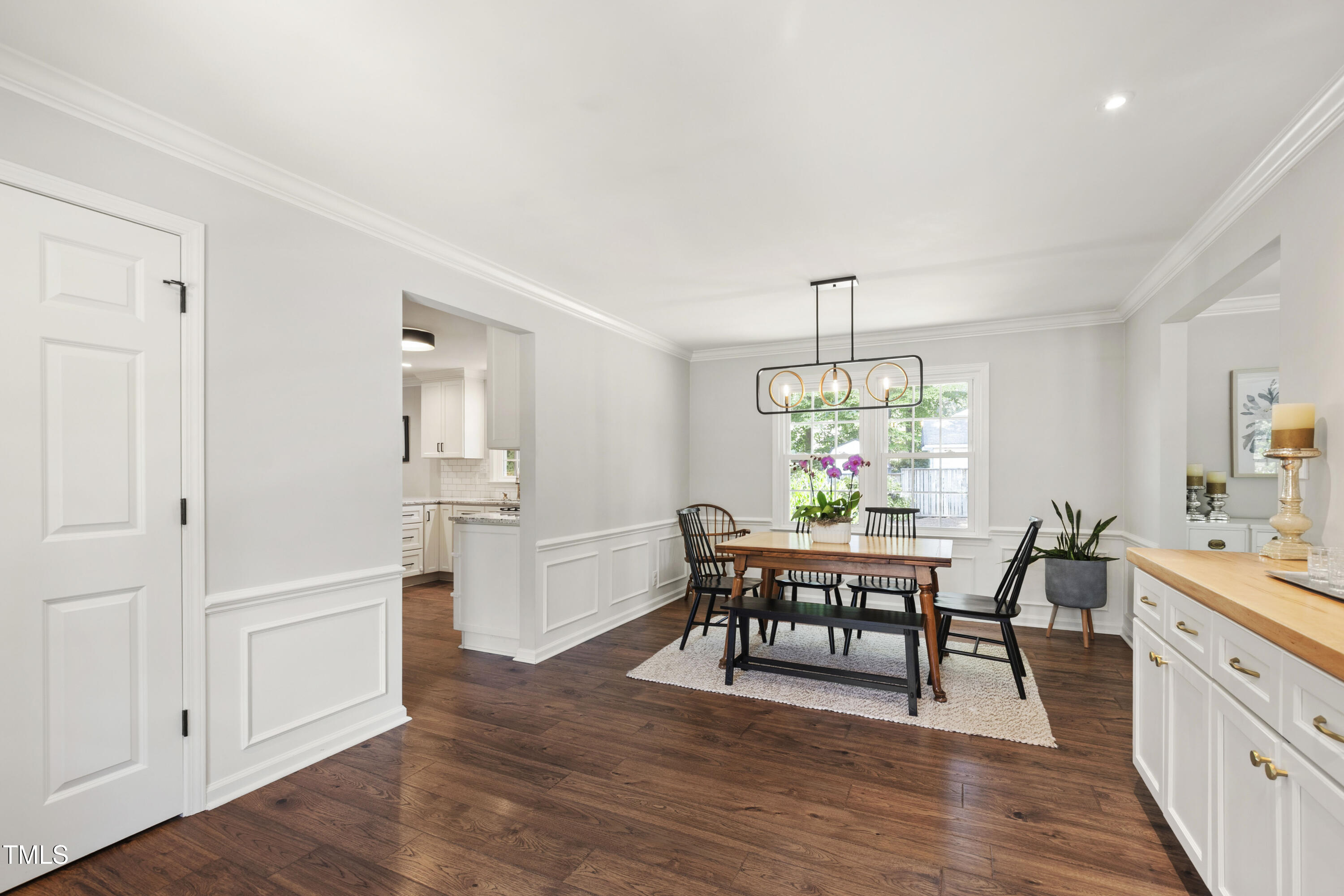 3209 Caldwell Drive Raleigh, NC 27607 - Photo 11 of 42 a view of a dining room with furniture window and wooden floor