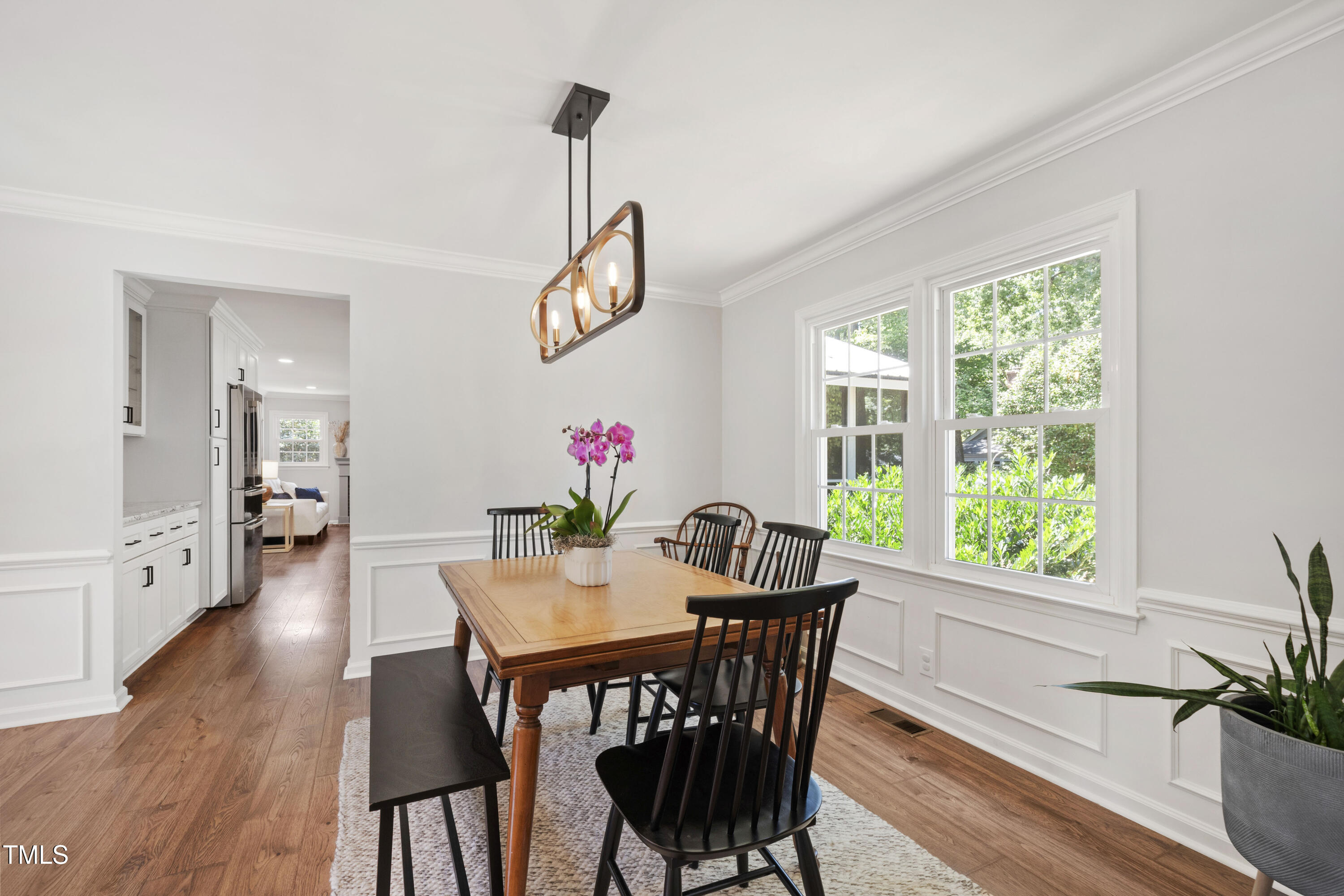 3209 Caldwell Drive Raleigh, NC 27607 - Photo 9 of 42 a view of a dining room with furniture window and wooden floor