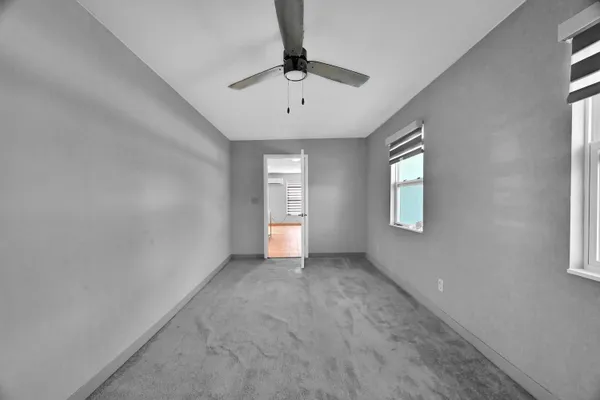 a view of an empty room with a window